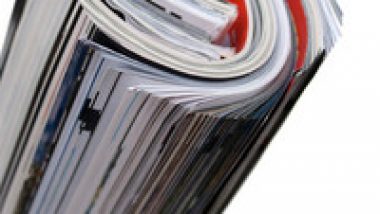 rolled-up-magazines-isolated-over-white-shallow-depth-of-field_BKUPwD0rj_thumb