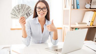 graphicstock-image-of-businesswoman-dressed-in-white-shirt-sitting-in-her-office-and-holding-money-in-hand-while-making-thumbs-up-gesture_SI3lOtY7uhg_thumb