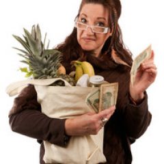 middle-aged-female-shopper-smiling-with-a-handful-of-cash-acting-proud-of-how-much-money-she-has-saved-on-her-grocery-shopping-bill_SKrVCwRBi_thumb