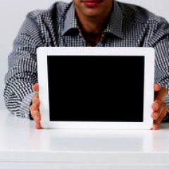 closeup-image-of-a-man-showing-tablet-comptuter-screen_thumb